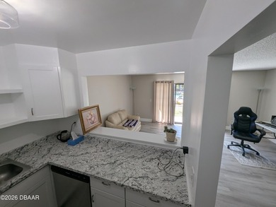 Step out your back door into the refreshing pool. Move in ready on Daytona Beach Golf Club in Florida - for sale on GolfHomes.com, golf home, golf lot