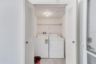Welcome to this bright and inviting 2 bedroom, 1.5 bath, ground on Cove Cay Country Club in Florida - for sale on GolfHomes.com, golf home, golf lot