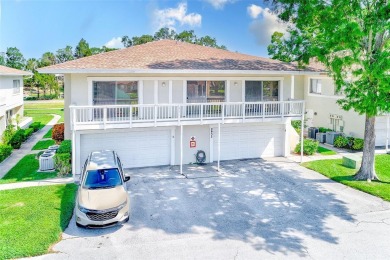 Welcome to this bright and inviting 2 bedroom, 1.5 bath, ground on Cove Cay Country Club in Florida - for sale on GolfHomes.com, golf home, golf lot