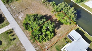 Discover waterfront bliss at 1908 NW 28th PL in Cape Coral, FL! on Coral Oaks Golf Course in Florida - for sale on GolfHomes.com, golf home, golf lot