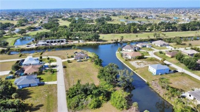 Discover waterfront bliss at 1908 NW 28th PL in Cape Coral, FL! on Coral Oaks Golf Course in Florida - for sale on GolfHomes.com, golf home, golf lot