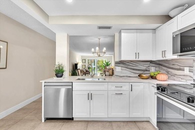 Experience unparalleled luxury in this reduced price *stunning* on Wynmoor Golf Course in Florida - for sale on GolfHomes.com, golf home, golf lot