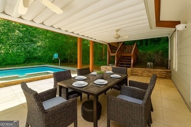 Step into luxury with this beautifully maintained two-story on Towne Lake Hills Golf Club in Georgia - for sale on GolfHomes.com, golf home, golf lot