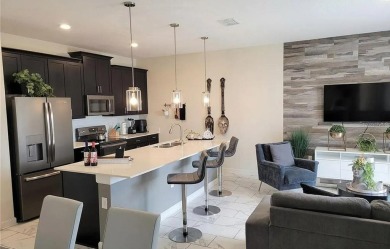 Welcome to this stunning Townhouse especially designed as a on ChampionsGate Golf Resort in Florida - for sale on GolfHomes.com, golf home, golf lot