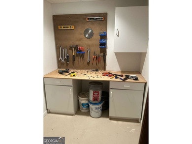 Step into luxury with this beautifully maintained two-story on Towne Lake Hills Golf Club in Georgia - for sale on GolfHomes.com, golf home, golf lot