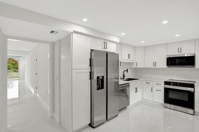 Welcome to this stunning fully renovated 3-bedroom, 2.5-bath on Palm-Aire Country Club and Resort - The Oaks in Florida - for sale on GolfHomes.com, golf home, golf lot