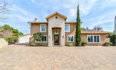 A paved driveway and elegant entrance welcome you to this on Newport Beach Golf Course in California - for sale on GolfHomes.com, golf home, golf lot