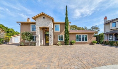 A paved driveway and elegant entrance welcome you to this on Newport Beach Golf Course in California - for sale on GolfHomes.com, golf home, golf lot