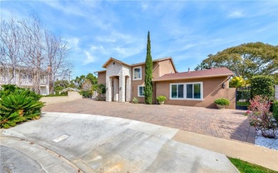 A paved driveway and elegant entrance welcome you to this on Newport Beach Golf Course in California - for sale on GolfHomes.com, golf home, golf lot