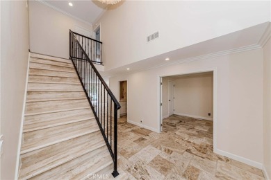 A paved driveway and elegant entrance welcome you to this on Newport Beach Golf Course in California - for sale on GolfHomes.com, golf home, golf lot