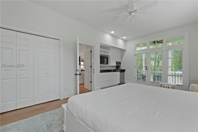 Coastal-chic golf cottage in the private, gated golf community on Berkeley Hall Golf Club in South Carolina - for sale on GolfHomes.com, golf home, golf lot
