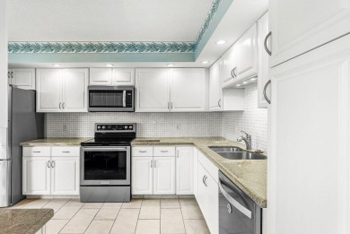 Experience relaxed living in this beautifully appointed on Quail Ridge Golf Course and Country Club in Florida - for sale on GolfHomes.com, golf home, golf lot