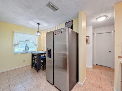 Lovely 2 bedroom home with split bedrooms, vaulted ceilings in on Summertree Golf Course in Florida - for sale on GolfHomes.com, golf home, golf lot