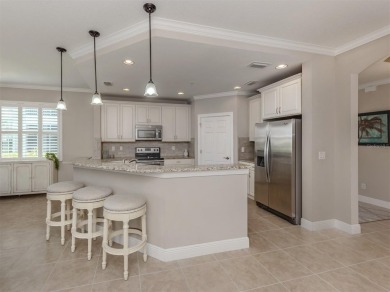 Come live the MAINTENANCE-FREE lifestyle in this beautifully on Venetian Golf and River Club in Florida - for sale on GolfHomes.com, golf home, golf lot