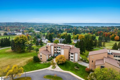 Absolutely stunning 1BR with views of East Bay from main living on  in Michigan - for sale on GolfHomes.com, golf home, golf lot
