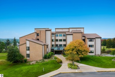 Absolutely stunning 1BR with views of East Bay from main living on  in Michigan - for sale on GolfHomes.com, golf home, golf lot