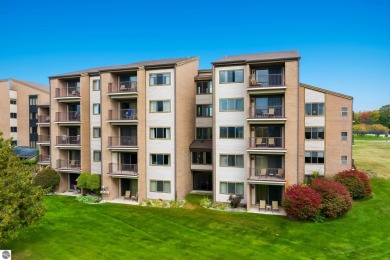 Absolutely stunning 1BR with views of East Bay from main living on  in Michigan - for sale on GolfHomes.com, golf home, golf lot