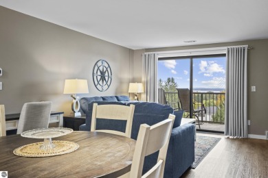 Absolutely stunning 1BR with views of East Bay from main living on  in Michigan - for sale on GolfHomes.com, golf home, golf lot
