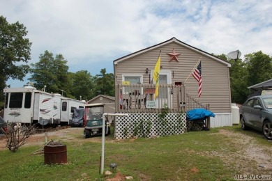 Check out this fully furnished 1994 camper with addition built on River Ridge Golf Club in Virginia - for sale on GolfHomes.com, golf home, golf lot