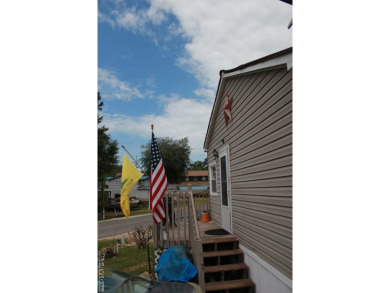 Check out this fully furnished 1994 camper with addition built on River Ridge Golf Club in Virginia - for sale on GolfHomes.com, golf home, golf lot