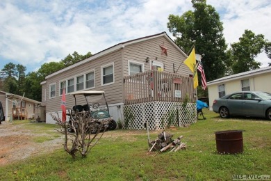 Check out this fully furnished 1994 camper with addition built on River Ridge Golf Club in Virginia - for sale on GolfHomes.com, golf home, golf lot