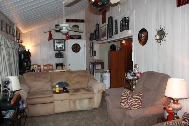 Check out this fully furnished 1994 camper with addition built on River Ridge Golf Club in Virginia - for sale on GolfHomes.com, golf home, golf lot