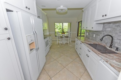 This spacious 3-bedroom, 2-bathroom home with a 2-car garage is on Heritage Ridge Golf Club in Florida - for sale on GolfHomes.com, golf home, golf lot