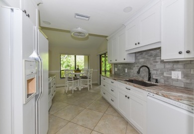 This spacious 3-bedroom, 2-bathroom home with a 2-car garage is on Heritage Ridge Golf Club in Florida - for sale on GolfHomes.com, golf home, golf lot