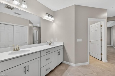 Experience serene resort-style living in this beautifully on Gateway Golf and Country Club in Florida - for sale on GolfHomes.com, golf home, golf lot