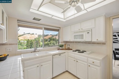 You'll love the two spacious balconies offering fantastic golf on Rossmoor Golf Course in California - for sale on GolfHomes.com, golf home, golf lot