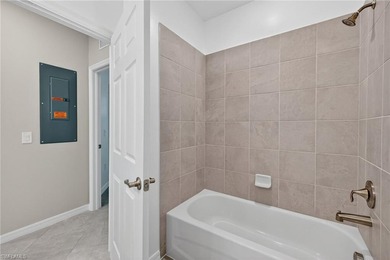 Experience serene resort-style living in this beautifully on Gateway Golf and Country Club in Florida - for sale on GolfHomes.com, golf home, golf lot