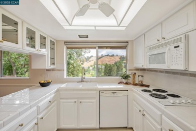 You'll love the two spacious balconies offering fantastic golf on Rossmoor Golf Course in California - for sale on GolfHomes.com, golf home, golf lot