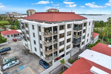 Discover your own slice of paradise in this beautiful 2-bedroom on Isla Del Sol Yacht and Country Club in Florida - for sale on GolfHomes.com, golf home, golf lot
