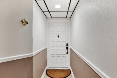 Discover your own slice of paradise in this beautiful 2-bedroom on Isla Del Sol Yacht and Country Club in Florida - for sale on GolfHomes.com, golf home, golf lot