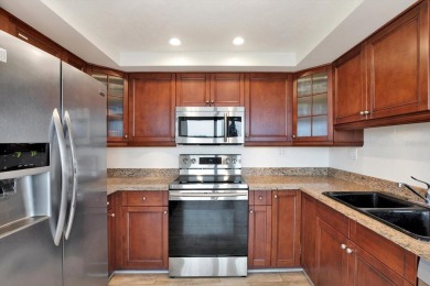 Discover your own slice of paradise in this beautiful 2-bedroom on Isla Del Sol Yacht and Country Club in Florida - for sale on GolfHomes.com, golf home, golf lot