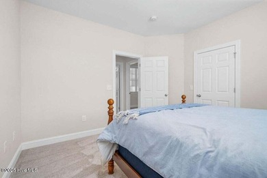 Step into easy one-level living in this 2023 carriage-style home on The Golf Club At Rocky Mount in North Carolina - for sale on GolfHomes.com, golf home, golf lot