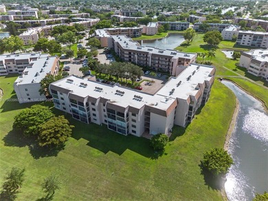 Newly reduced price! Welcome to this quiet, end unit on the 4th on Sunrise Lakes Phase IV Golf Course in Florida - for sale on GolfHomes.com, golf home, golf lot