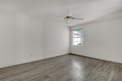 This 2-bedroom, 2-bathroom home with a split floor plan offers on The Golf Club of Jupiter in Florida - for sale on GolfHomes.com, golf home, golf lot