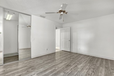 This 2-bedroom, 2-bathroom home with a split floor plan offers on The Golf Club of Jupiter in Florida - for sale on GolfHomes.com, golf home, golf lot