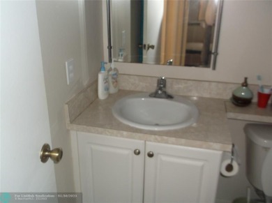 LOVELY 2 BEDROOM 2 BATH CONDO IN FABULOUS SUNRISE LAKES PHASE 3 on Sunrise Lakes Phase III in Florida - for sale on GolfHomes.com, golf home, golf lot