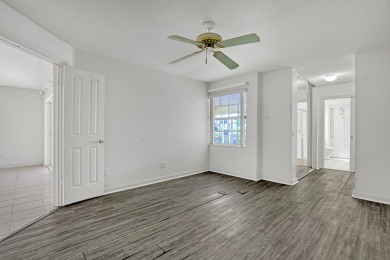 This 2-bedroom, 2-bathroom home with a split floor plan offers on The Golf Club of Jupiter in Florida - for sale on GolfHomes.com, golf home, golf lot