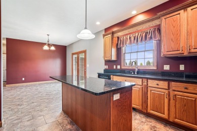 Set in a highly desirable neighborhood near the golf course on Hart Ridge Golf Course in Iowa - for sale on GolfHomes.com, golf home, golf lot