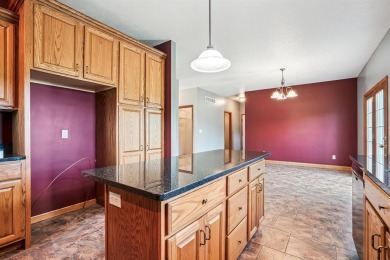 Set in a highly desirable neighborhood near the golf course on Hart Ridge Golf Course in Iowa - for sale on GolfHomes.com, golf home, golf lot
