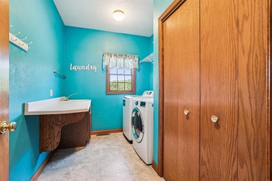 Set in a highly desirable neighborhood near the golf course on Hart Ridge Golf Course in Iowa - for sale on GolfHomes.com, golf home, golf lot