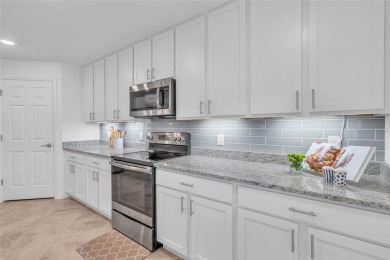 This exquisite FIRST FLOOR COACH home is just steps from one of on Heritage Landing Golf  in Florida - for sale on GolfHomes.com, golf home, golf lot