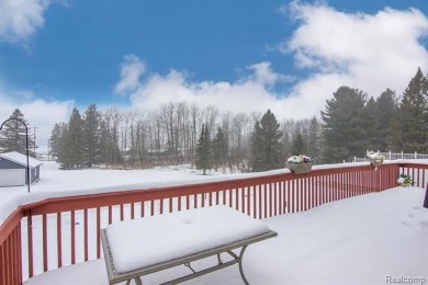 Welcome to this inviting raised ranch style home nestled within on Lost Lake Woods Club in Michigan - for sale on GolfHomes.com, golf home, golf lot