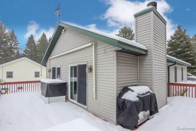 Welcome to this inviting raised ranch style home nestled within on Lost Lake Woods Club in Michigan - for sale on GolfHomes.com, golf home, golf lot