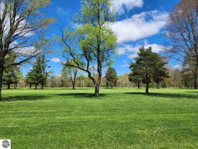 Golf, Hunt  Relax!  Nestled in the heart of Lakes of the North on Lakes of the North Deer Run Golf Course in Michigan - for sale on GolfHomes.com, golf home, golf lot