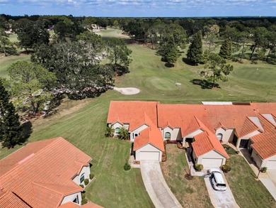 GOLFER'S DELIGHT! END UNIT with stunning GOLF COURSE VIEWS on on Highland Lakes Executive Golf Course in Florida - for sale on GolfHomes.com, golf home, golf lot