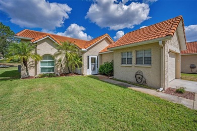GOLFER'S DELIGHT! END UNIT with stunning GOLF COURSE VIEWS on on Highland Lakes Executive Golf Course in Florida - for sale on GolfHomes.com, golf home, golf lot